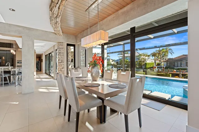 a dining area with furniture and outdoor view