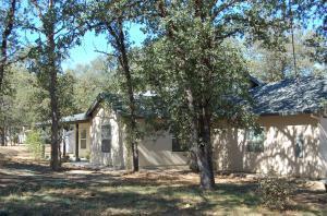7487 White Oak Road Corning, CA 96021 - Photo 2 of 3 a view of road with large trees