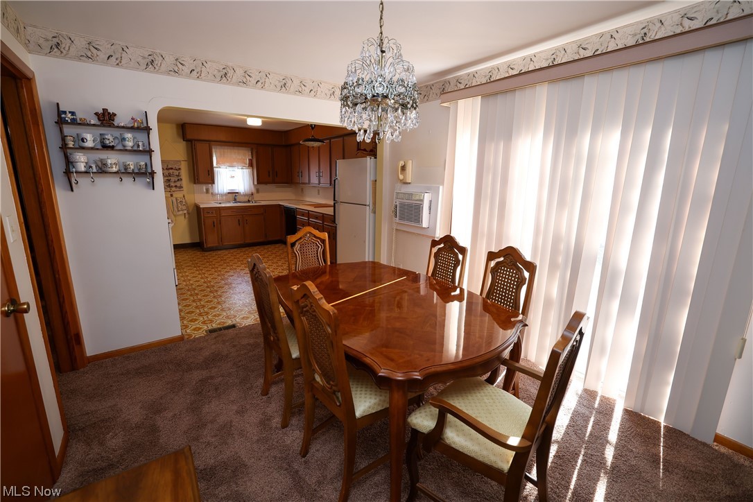 29252 Barjode Road Willowick, OH 44095 - Photo 7 of 21 Carpeted dining area with a chandelier