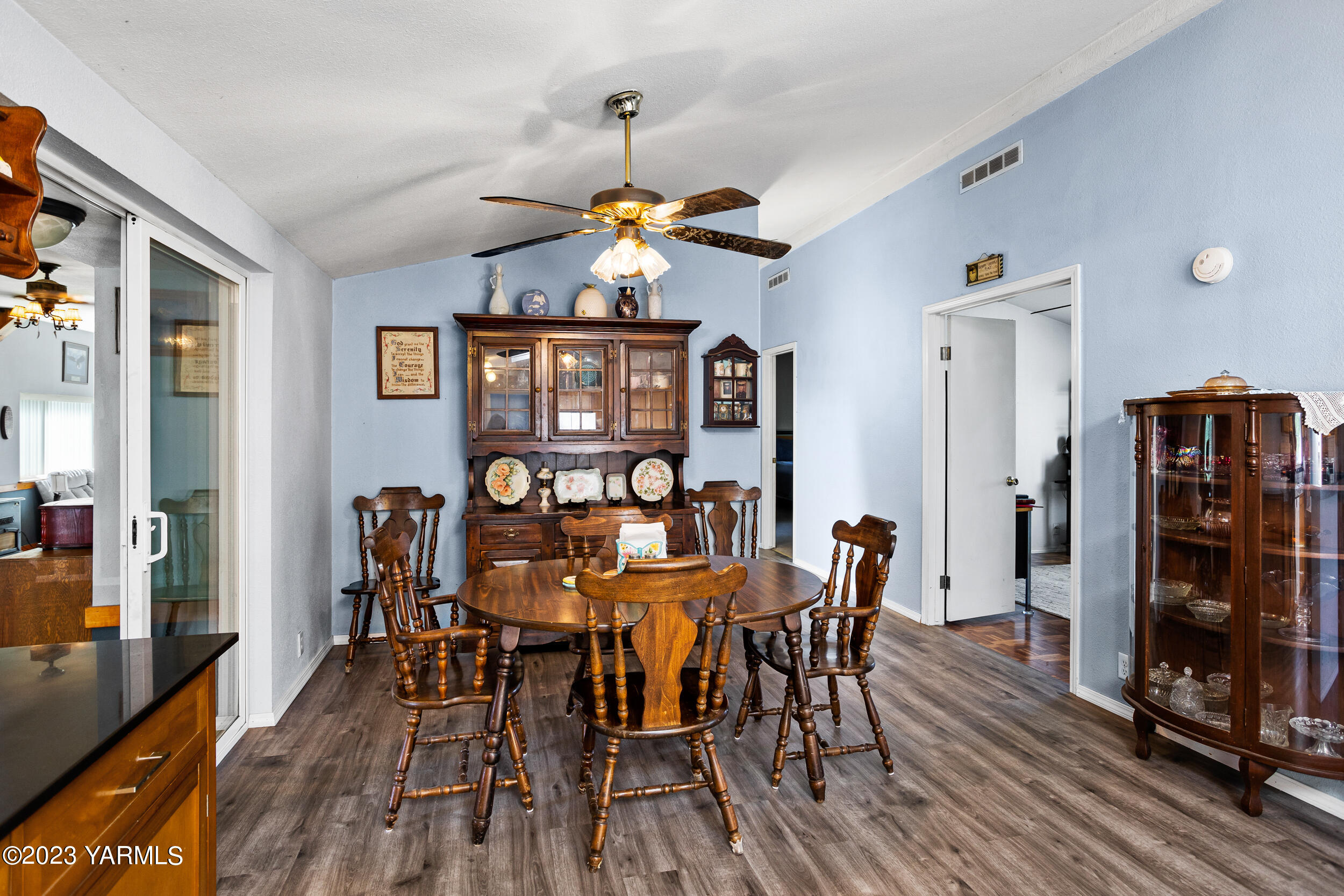 910 Robinson Road Grandview, WA 98930 - Photo 14 of 37 a view of a dining room with furniture and chandelier