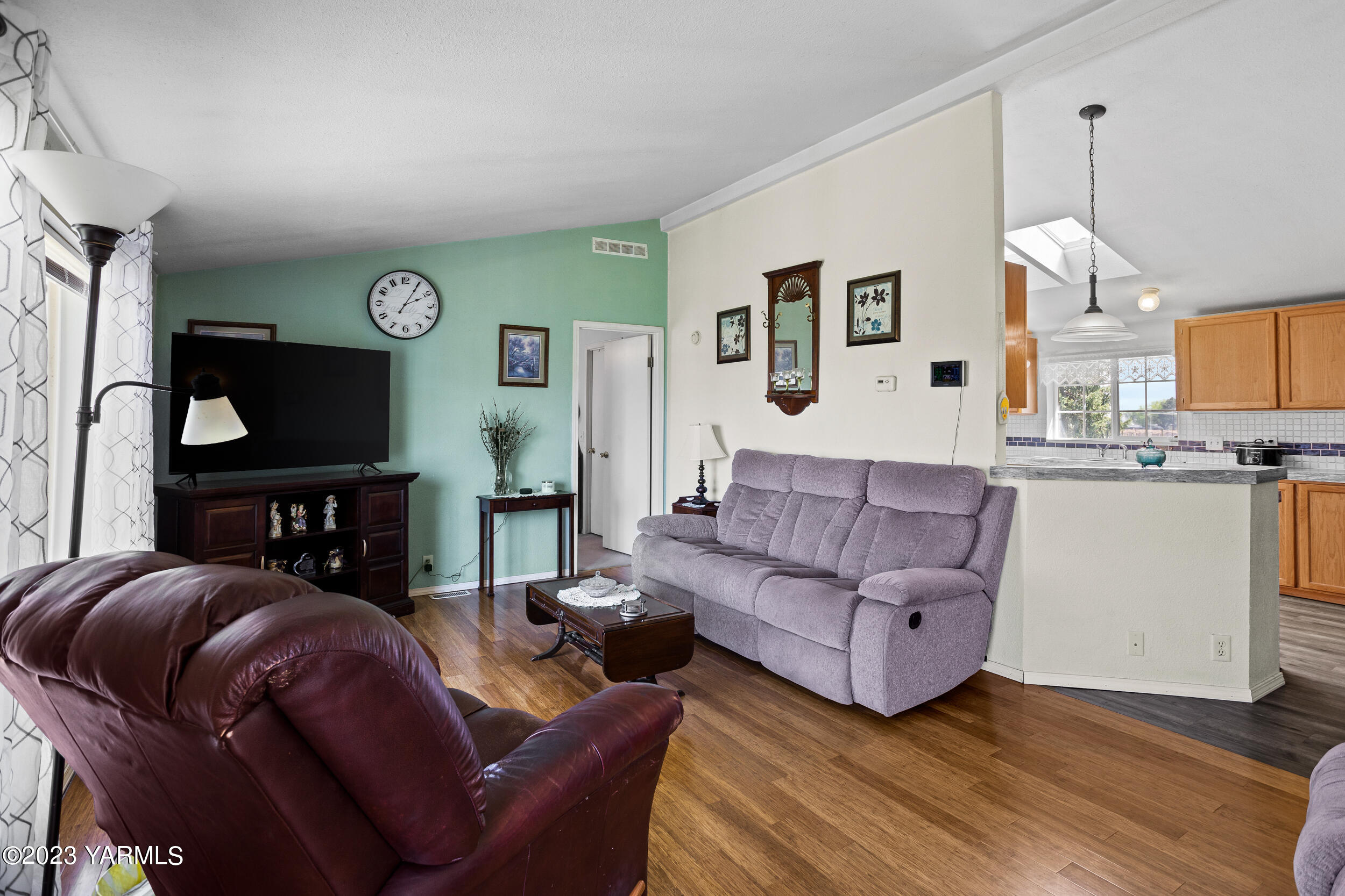 910 Robinson Road Grandview, WA 98930 - Photo 6 of 37 a living room with furniture and a flat screen tv