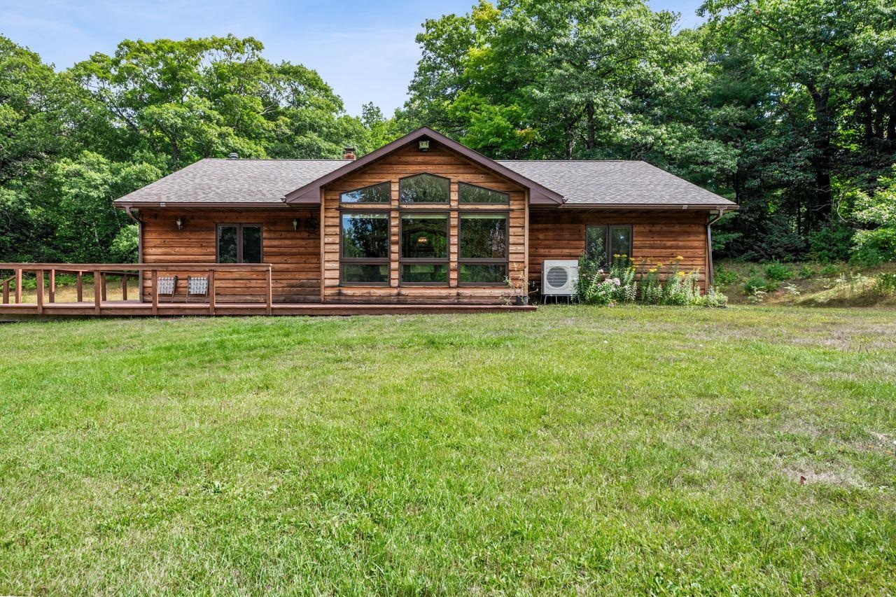 75920 Ondossagon Road Washburn, WI 54891 - Photo 23 of 29 Back of house featuring roof with shingles and a lawn
