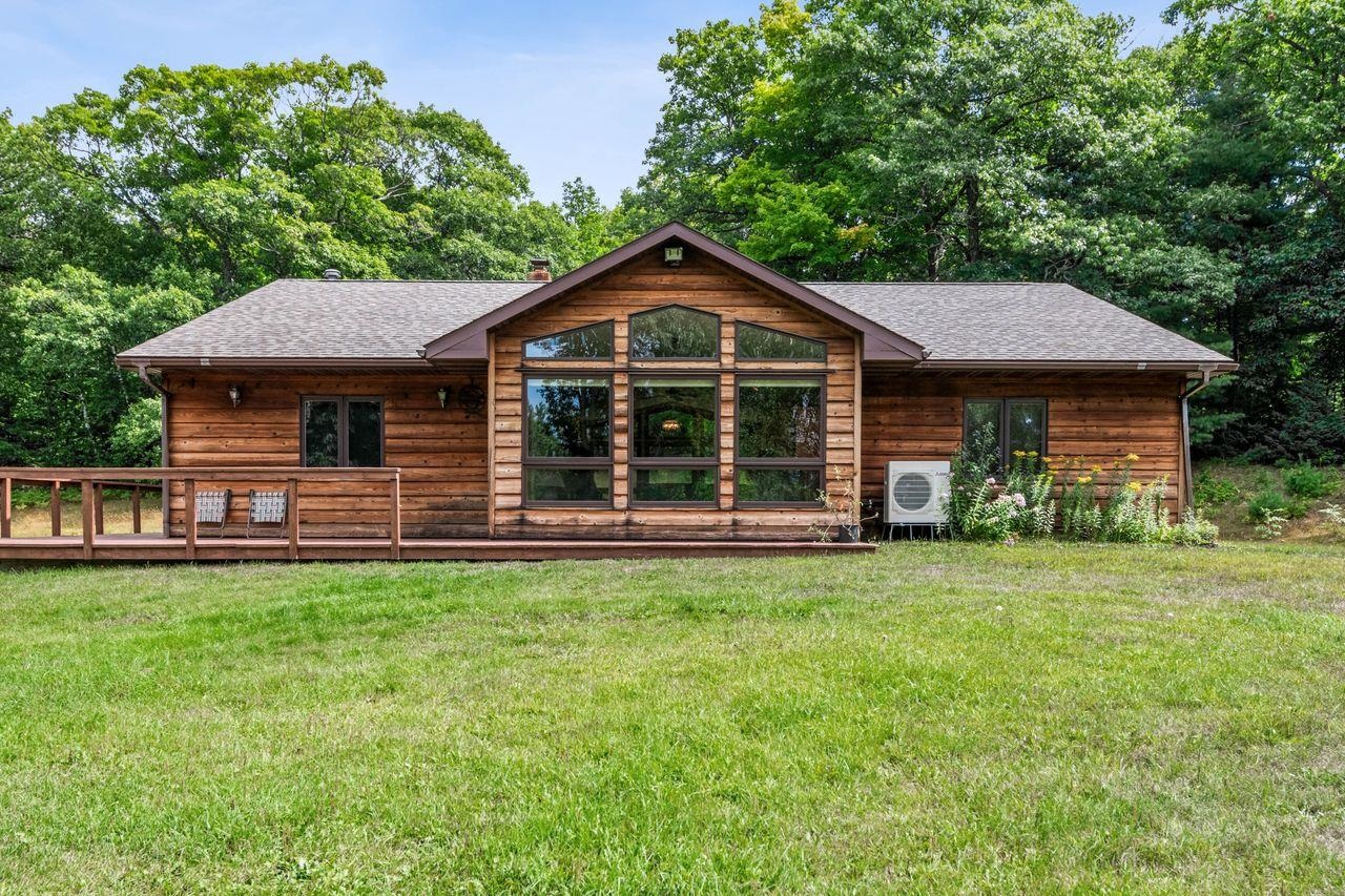 75920 Ondossagon Road Washburn, WI 54891 - Photo 28 of 29 Rear view of property featuring a shingled roof, a lawn, and a wooden deck