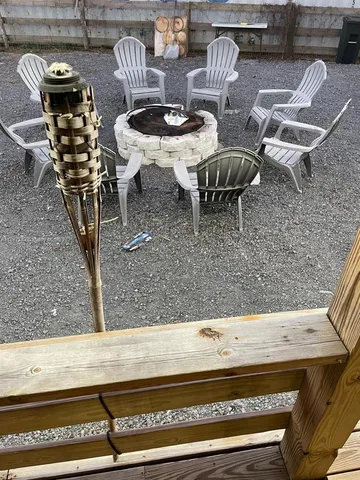 a view of a porch with furniture and garden