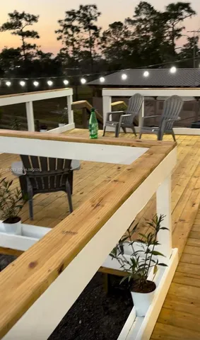 a view of swimming pool with outdoor seating