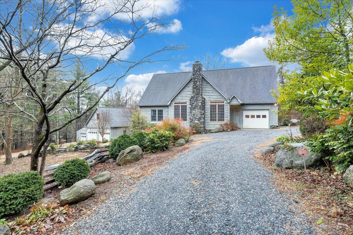 1220 Karnes Road Bedford, VA 24523 - Photo 1 of 1 a front view of a house with a garden
