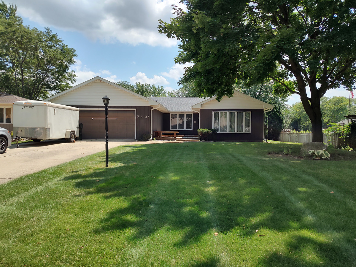 540 Mohican Road Carol Stream, IL 60188 - Photo 1 of 36 a front view of a house with a yard and trees