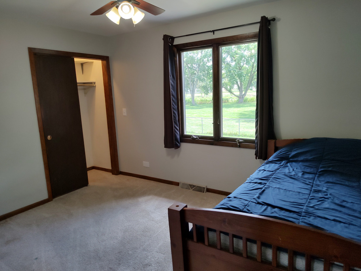540 Mohican Road Carol Stream, IL 60188 - Photo 17 of 36 a bedroom with a bed and a window