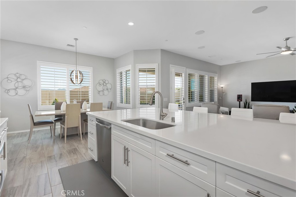 1545 Rio Grande Beaumont, CA 92223 - Photo 12 of 34 a large white kitchen with a large window