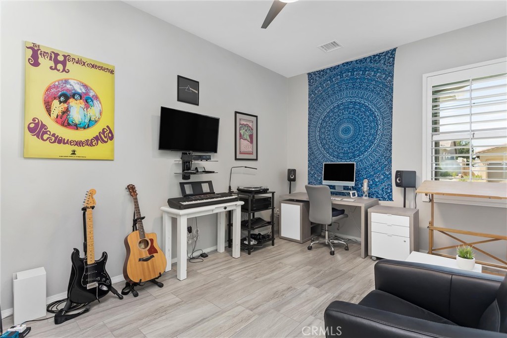 1545 Rio Grande Beaumont, CA 92223 - Photo 15 of 34 a view of a livingroom with workspace and a window