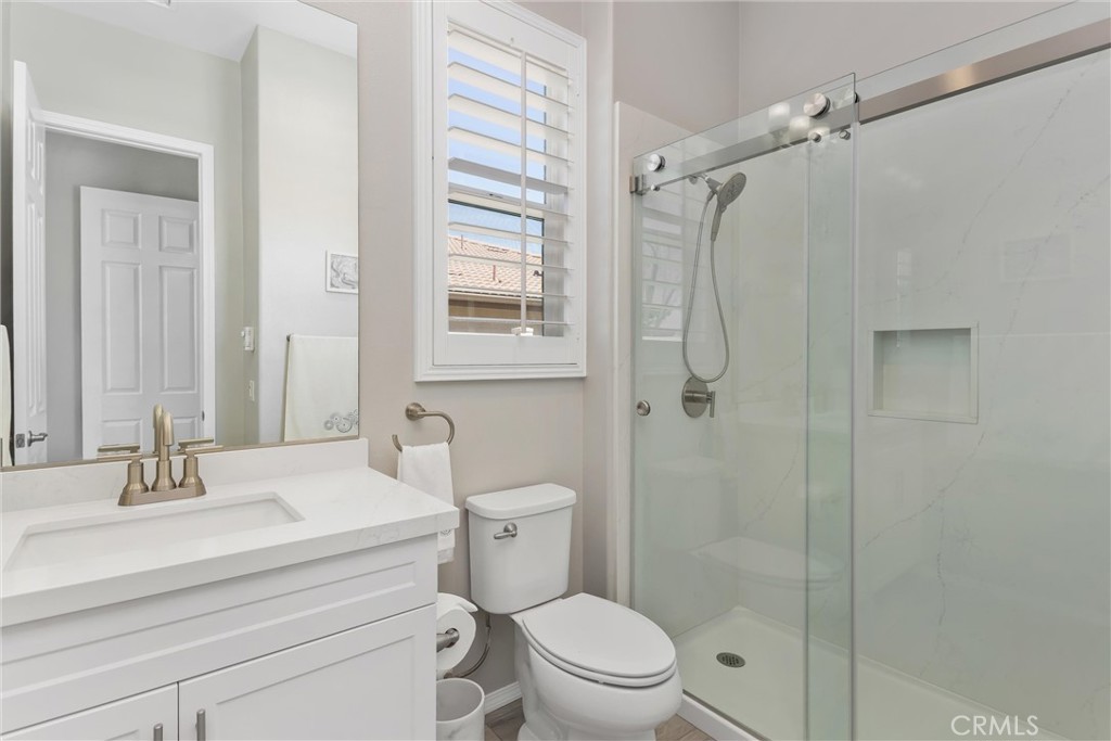 1545 Rio Grande Beaumont, CA 92223 - Photo 18 of 34 a bathroom with a sink a toilet and shower