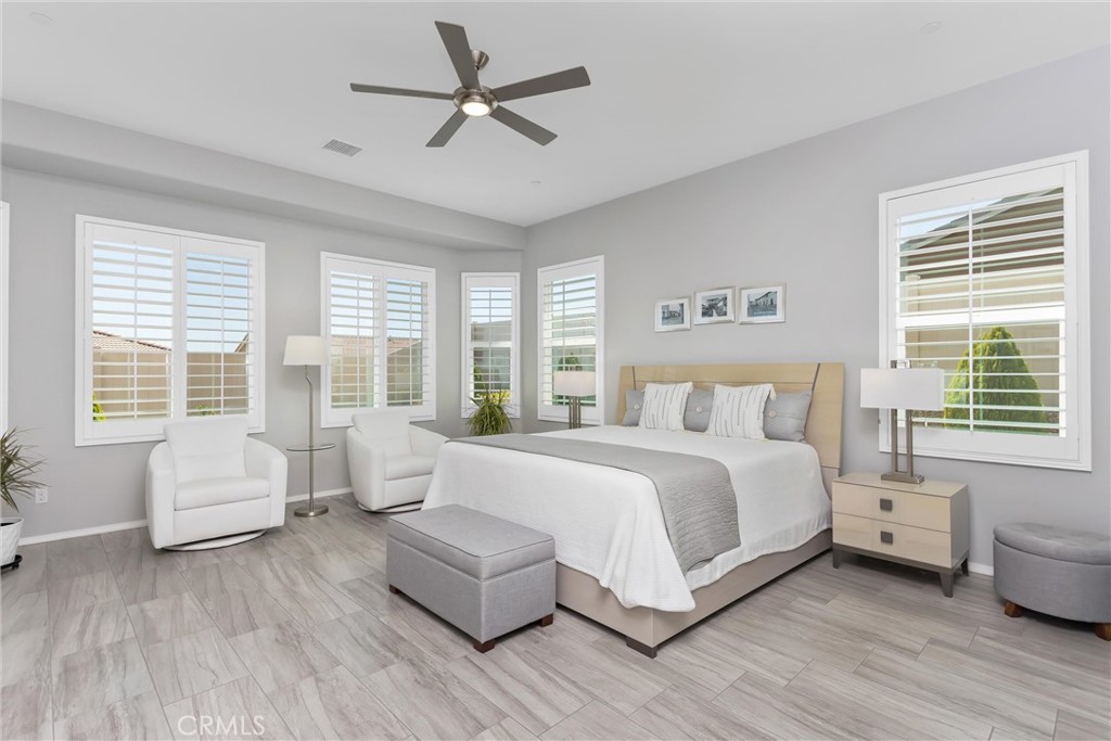 1545 Rio Grande Beaumont, CA 92223 - Photo 21 of 34 a bedroom with a bed couch and a large window