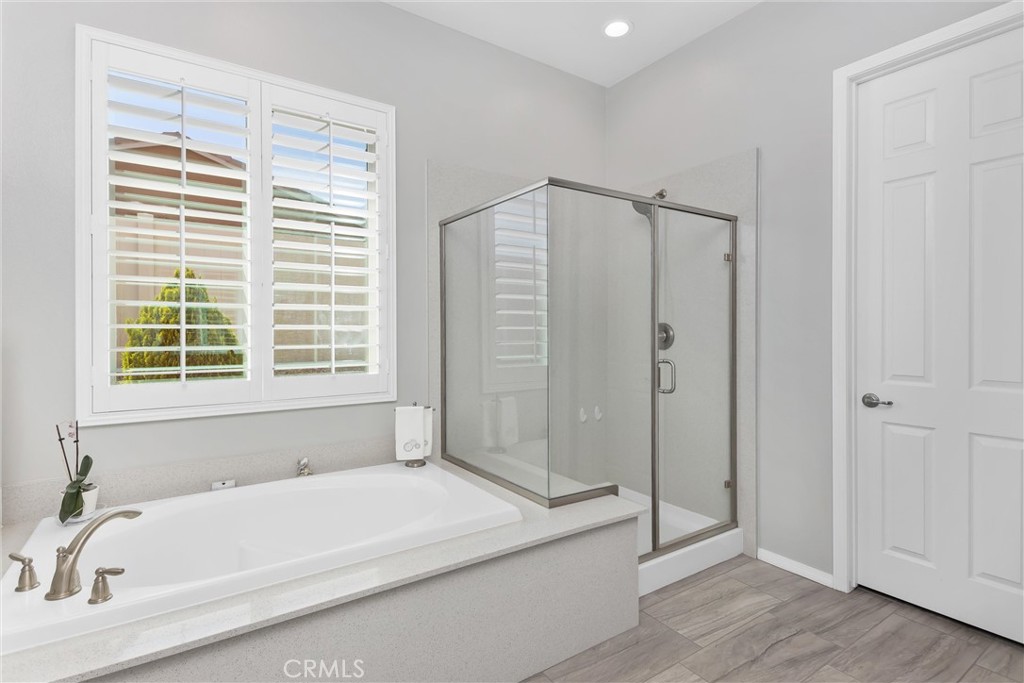 1545 Rio Grande Beaumont, CA 92223 - Photo 25 of 34 a bathroom with a bathtub and a shower