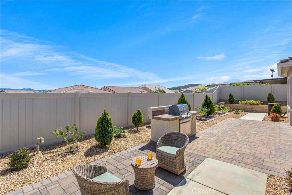 1545 Rio Grande Beaumont, CA 92223 - Photo 27 of 34 a view of a terrace with furniture and a garden