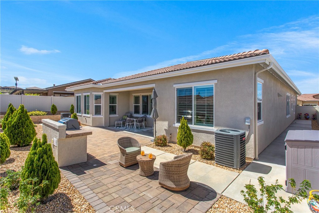 1545 Rio Grande Beaumont, CA 92223 - Photo 29 of 34 a view of a patio with couches chairs and potted plants