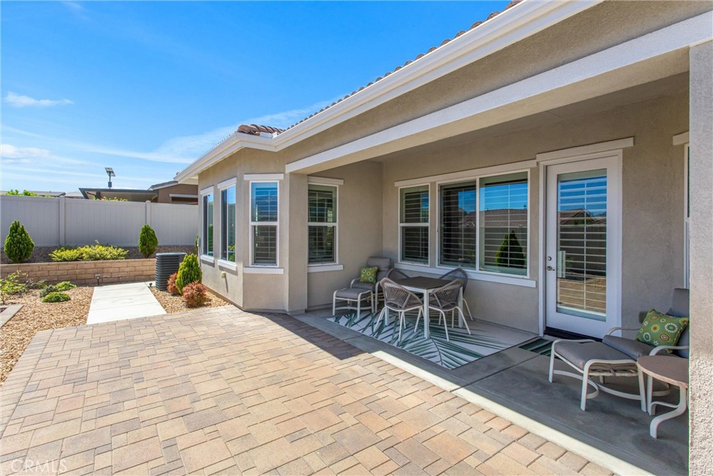 1545 Rio Grande Beaumont, CA 92223 - Photo 30 of 34 a view of a dinning tables and chairs in patio of the house