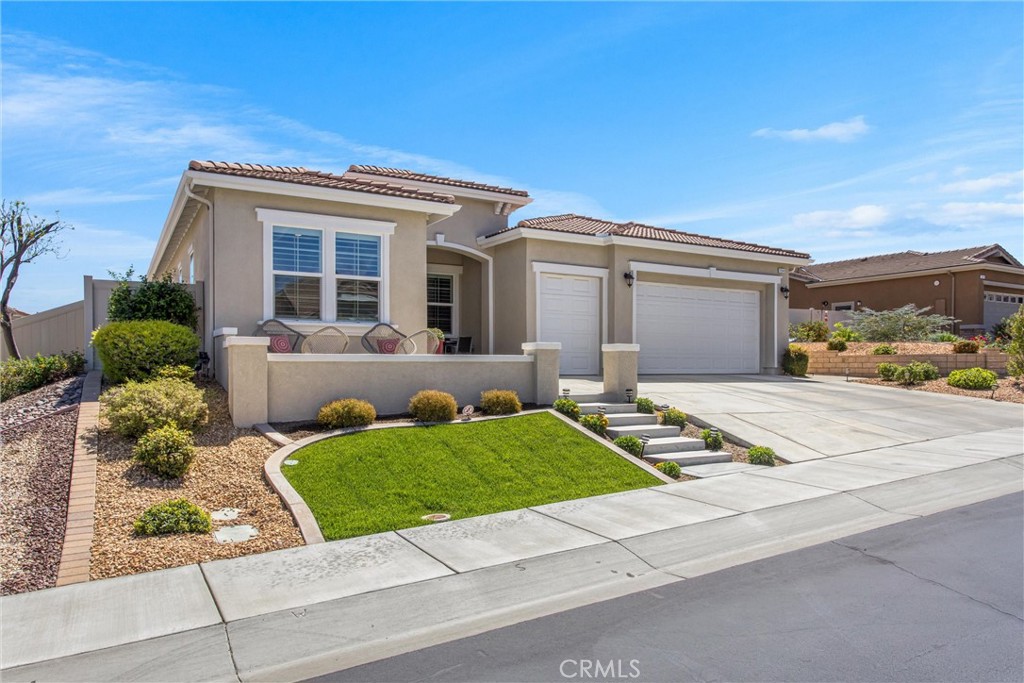 1545 Rio Grande Beaumont, CA 92223 - Photo 4 of 34 a front view of a house with garden