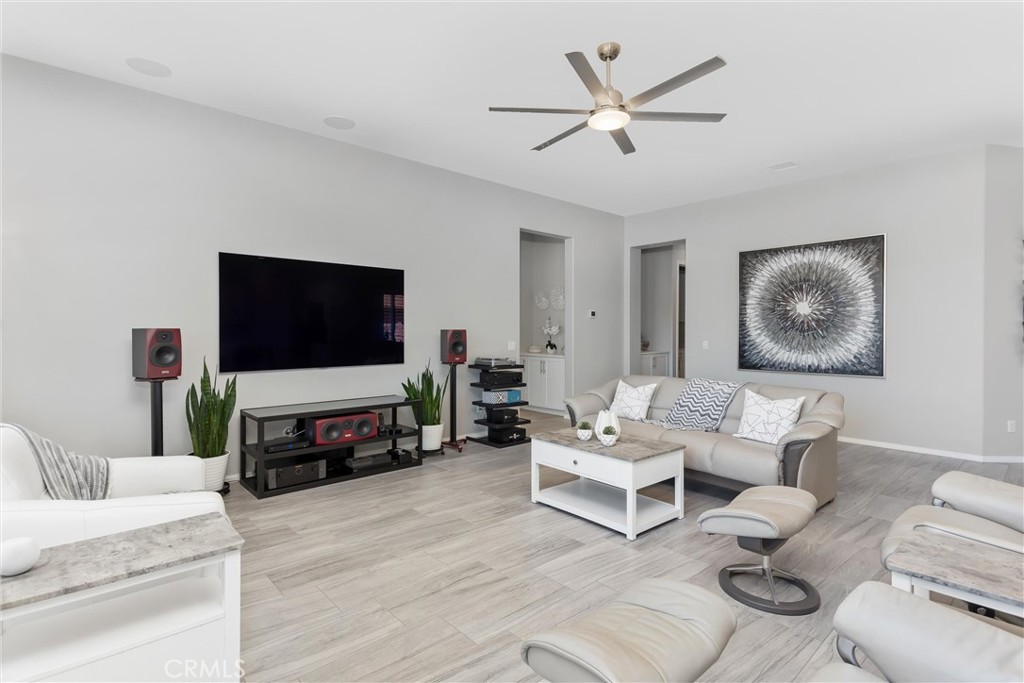 1545 Rio Grande Beaumont, CA 92223 - Photo 6 of 34 a living room with furniture and a flat screen tv