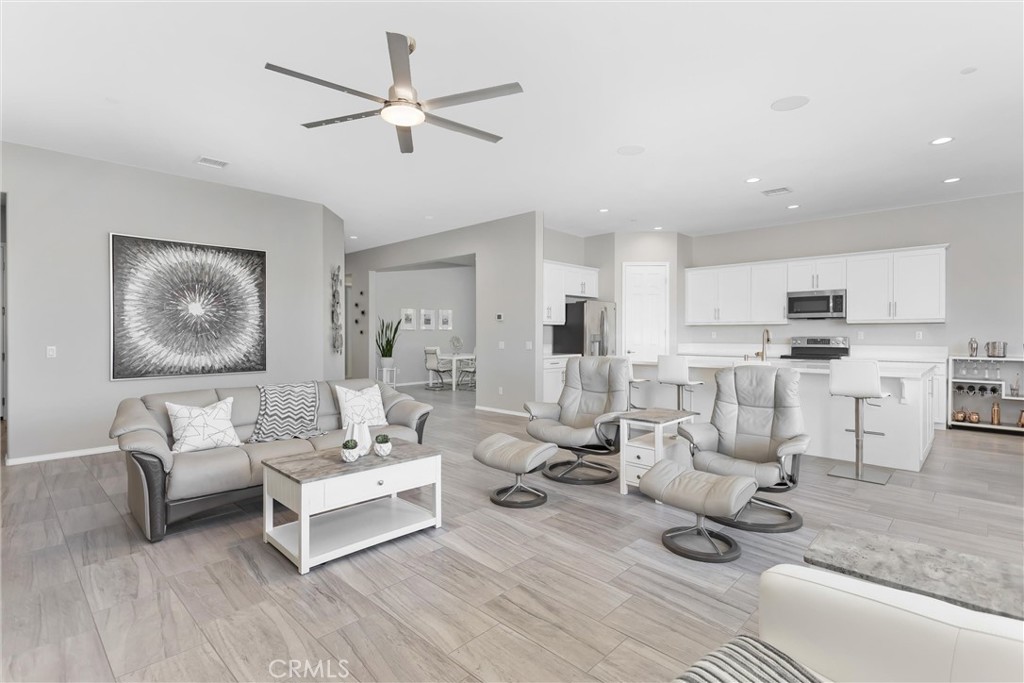 1545 Rio Grande Beaumont, CA 92223 - Photo 7 of 34 a living room with furniture and view of kitchen