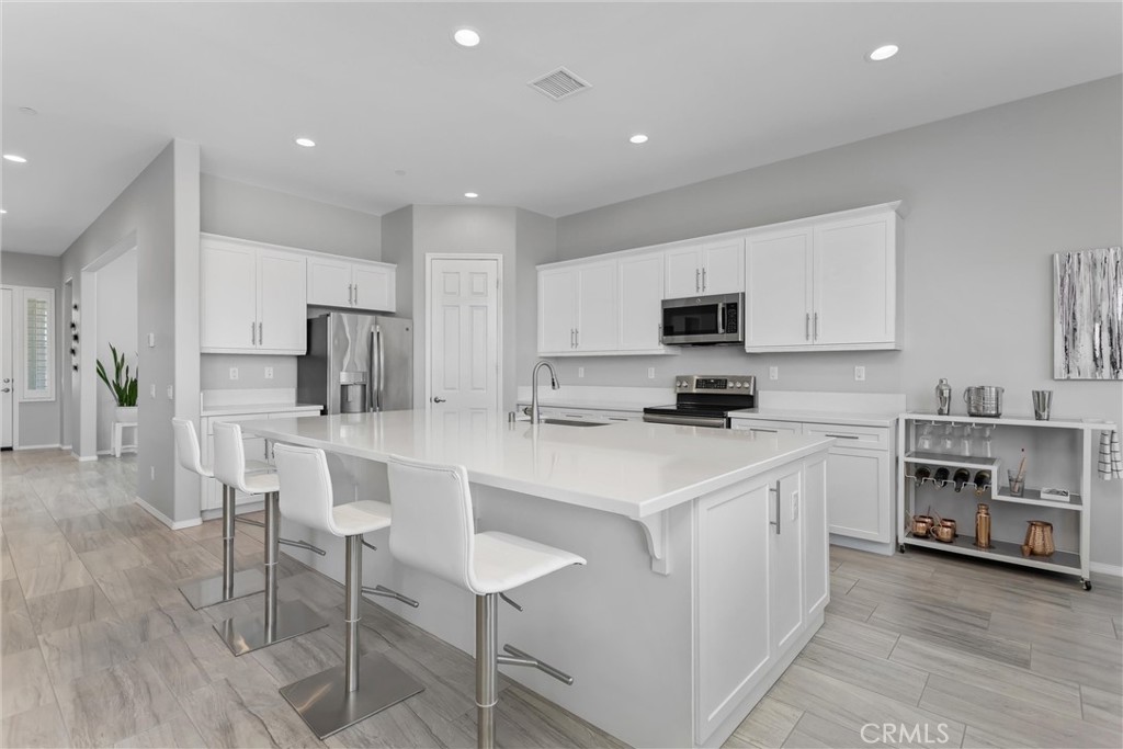 1545 Rio Grande Beaumont, CA 92223 - Photo 9 of 34 a kitchen with a sink cabinets and stainless steel appliances