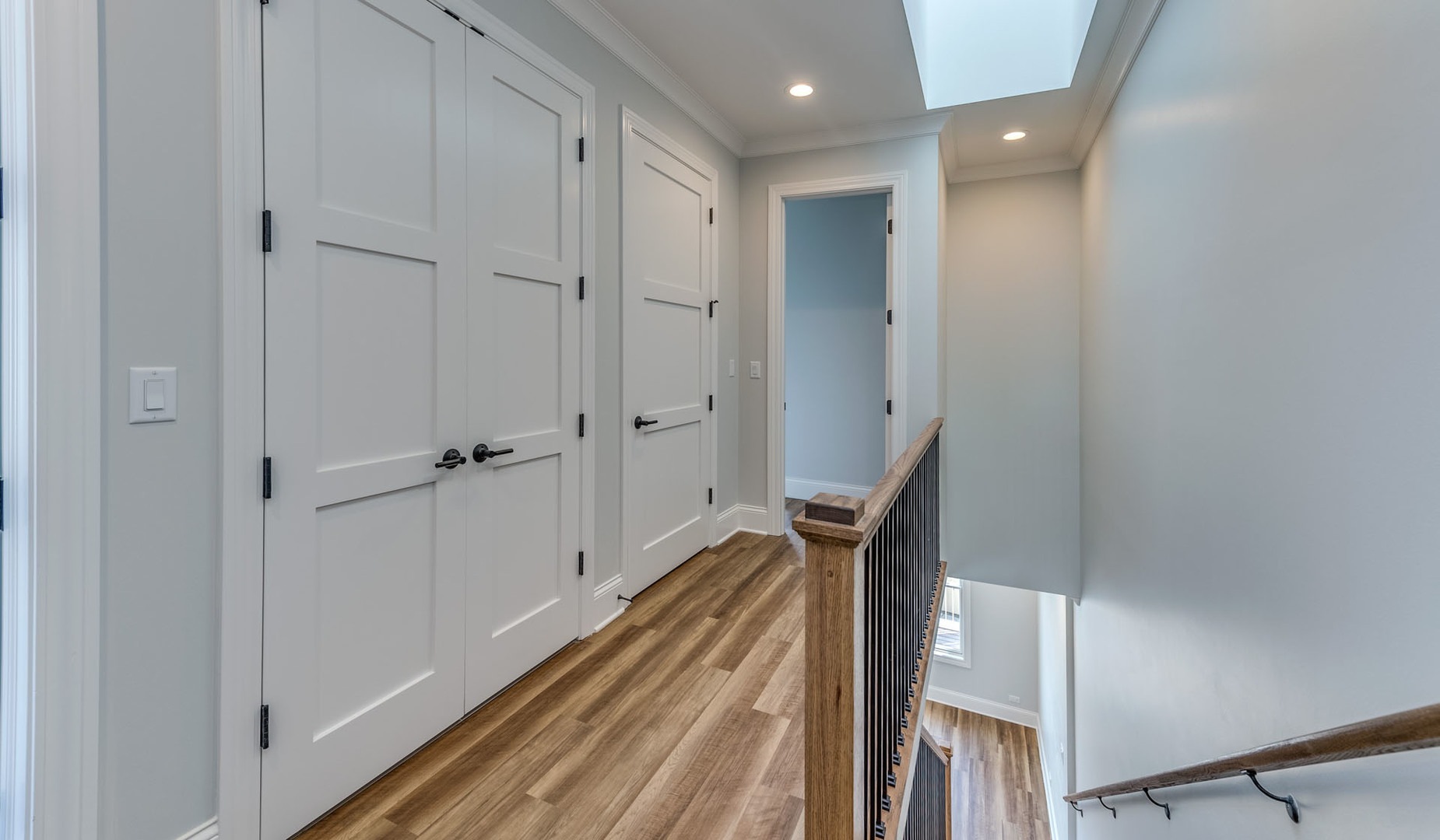 1171 South Eldridge Lane Elmhurst, IL 60126 - Photo 14 of 18 a view of a hallway with wooden floor and staircase