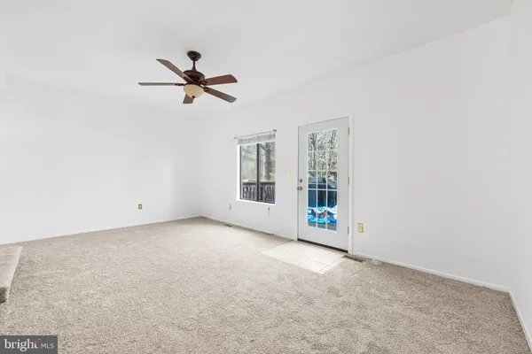 an empty room with fan