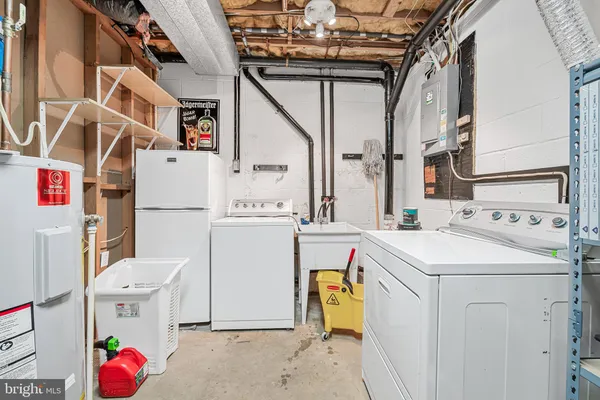 a view of a livingroom with furniture and a workspace