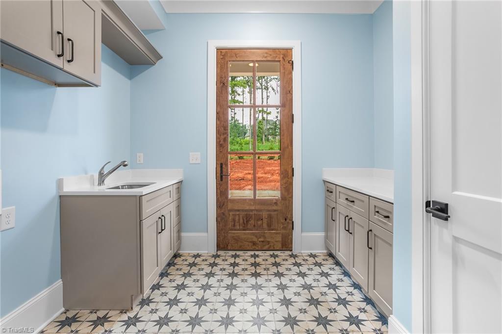 8015 Cranston Court Oak Ridge, NC 27310 - Photo 19 of 46 laundry room