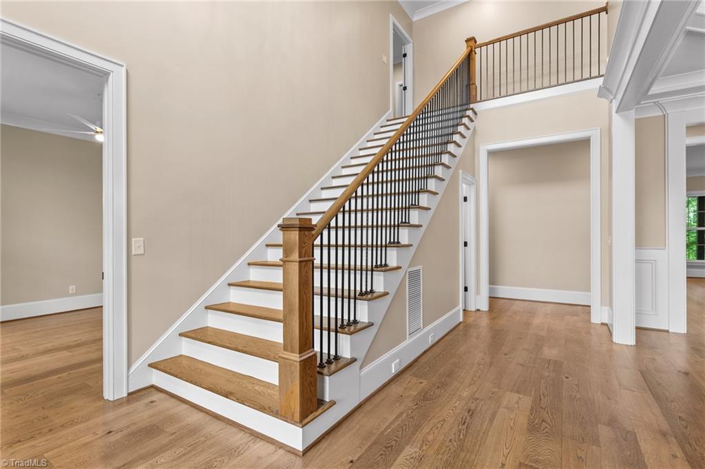 8015 Cranston Court Oak Ridge, NC 27310 - Photo 8 of 46 extra wide stately staircase