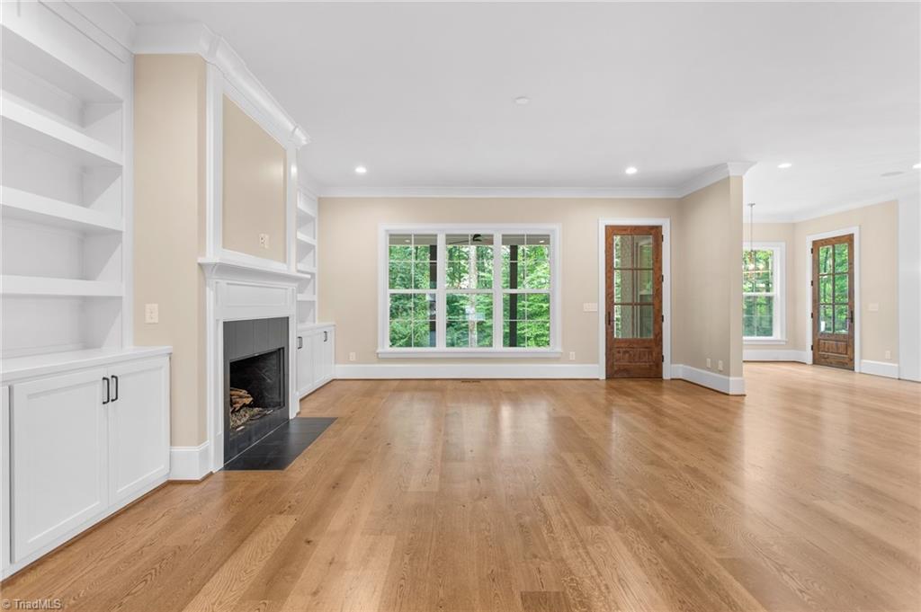 8015 Cranston Court Oak Ridge, NC 27310 - Photo 10 of 46 great room with built ins flanking the fireplace