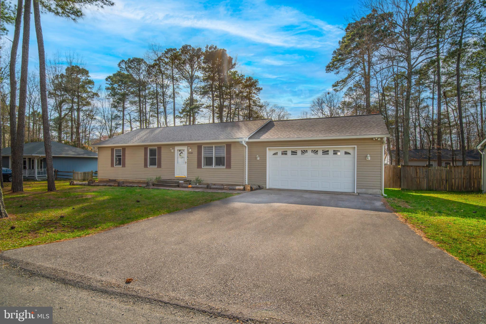 11543 San Rafael Road Lusby, MD 20657 - Photo 1 of 20 front view of a house with a yard and a garage