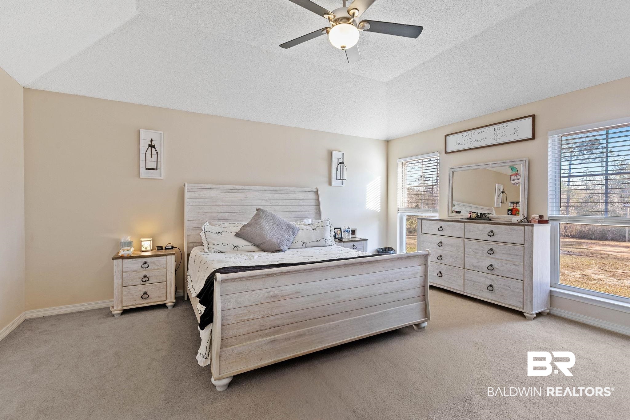 55750 Lottie Road Perdido, AL 36562 - Photo 57 of 84 Bedroom with light carpet, lofted ceiling, and a ceiling fan
