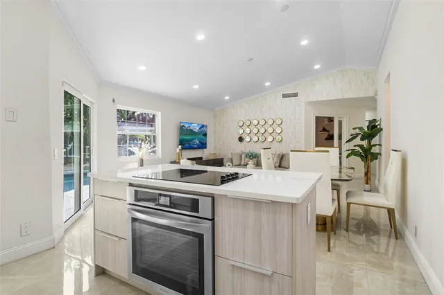a kitchen that has a stove and a table