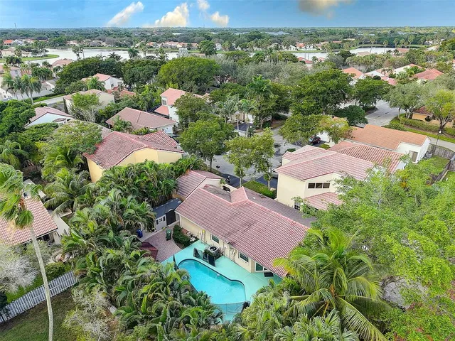 an aerial view of house with yard