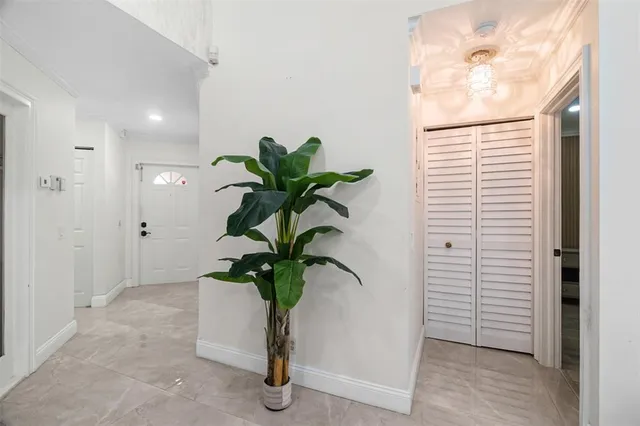 a view of a hallway with potted plant
