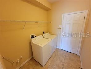 11637 Great Commission Way Orlando, FL 32832 - Photo 16 of 19 a utility room with dryer and washer