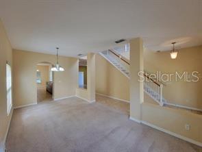 11637 Great Commission Way Orlando, FL 32832 - Photo 6 of 19 a view of a big room with an entryway and fireplace