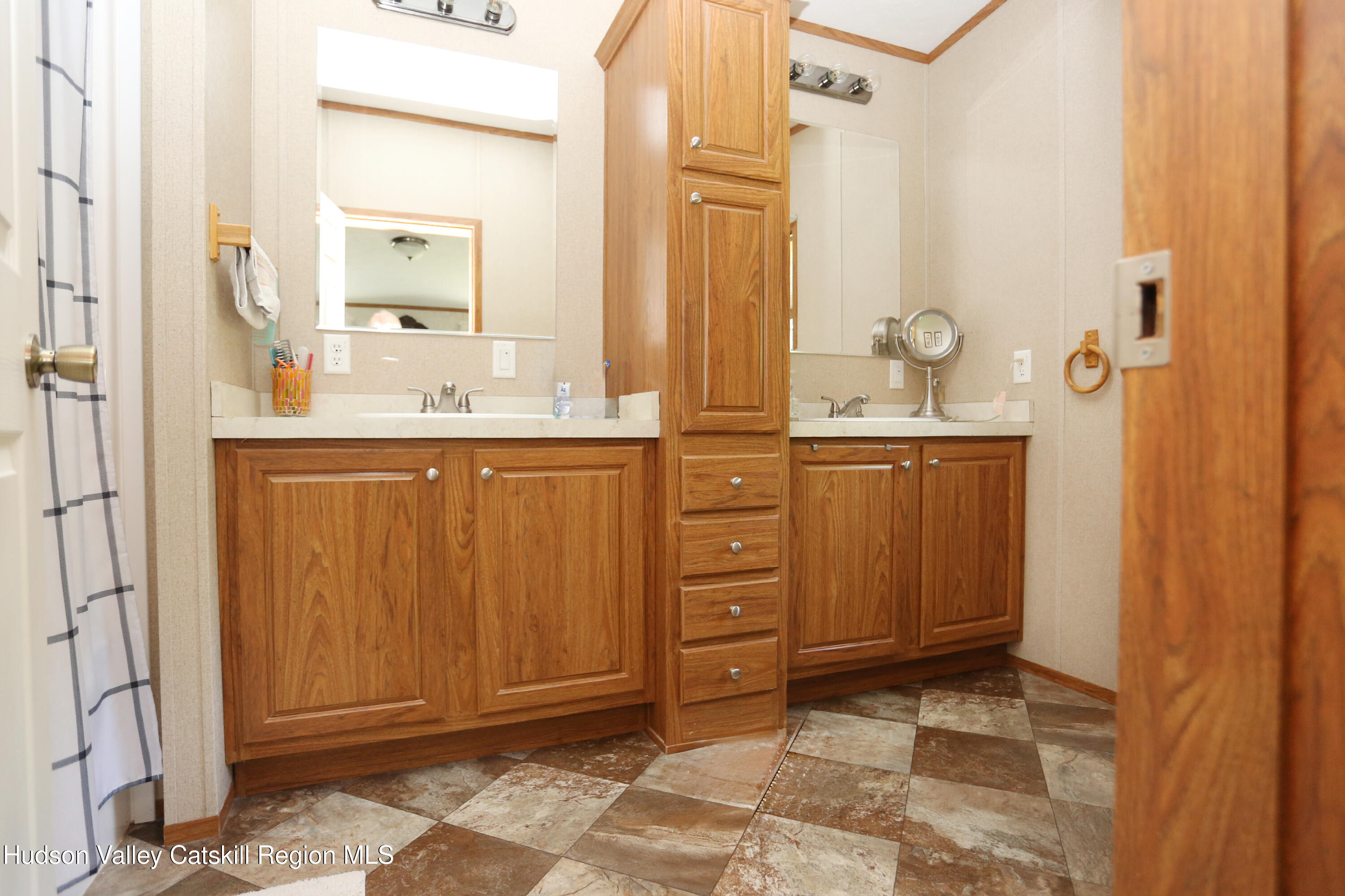219 Edison Timmerman Road Cairo, NY 12413 - Photo 16 of 51 a bathroom with a sink a mirror and a shower