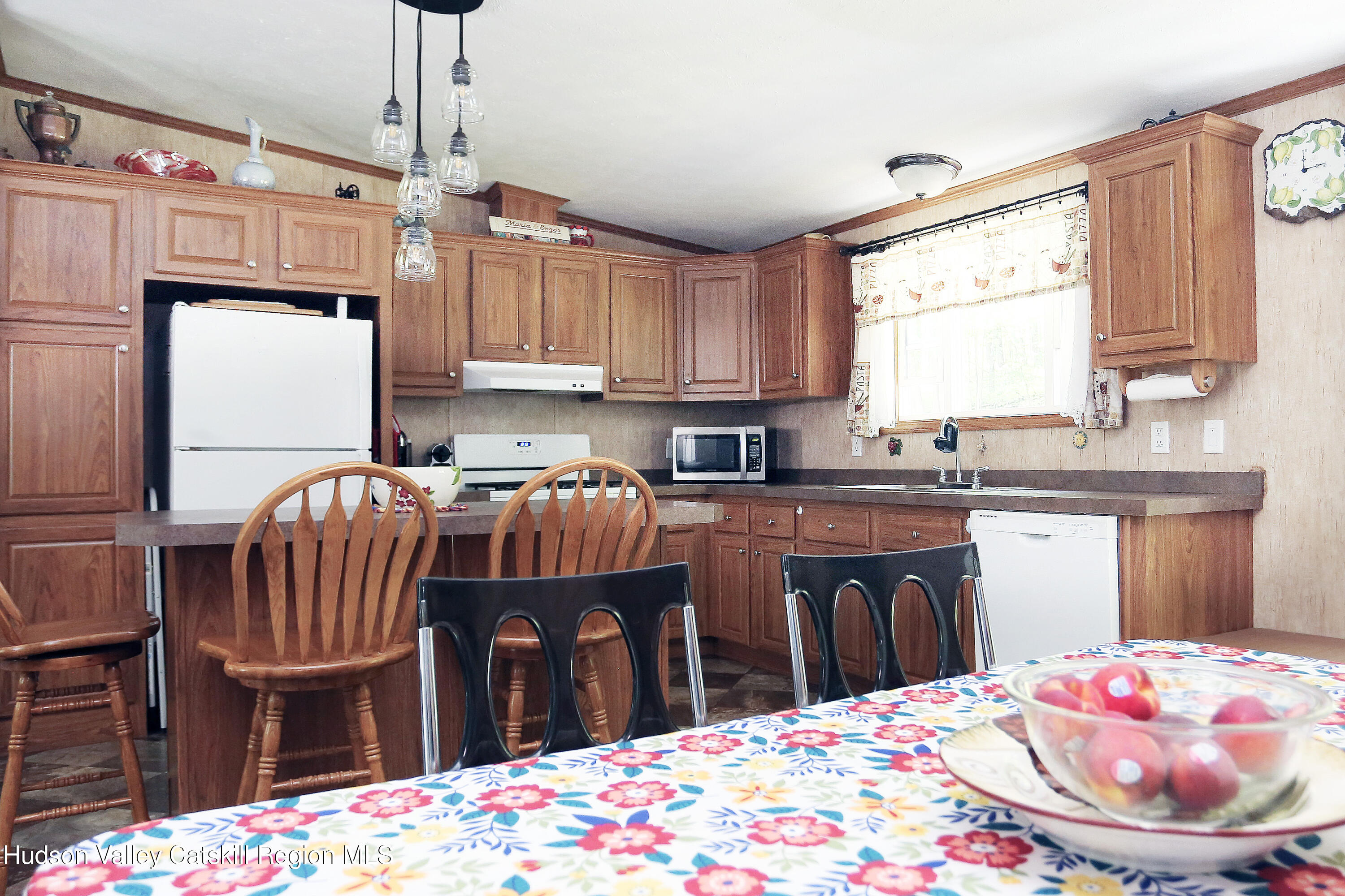 219 Edison Timmerman Road Cairo, NY 12413 - Photo 3 of 51 a kitchen with stainless steel appliances kitchen island granite countertop a sink dishwasher and cabinets with wooden floor