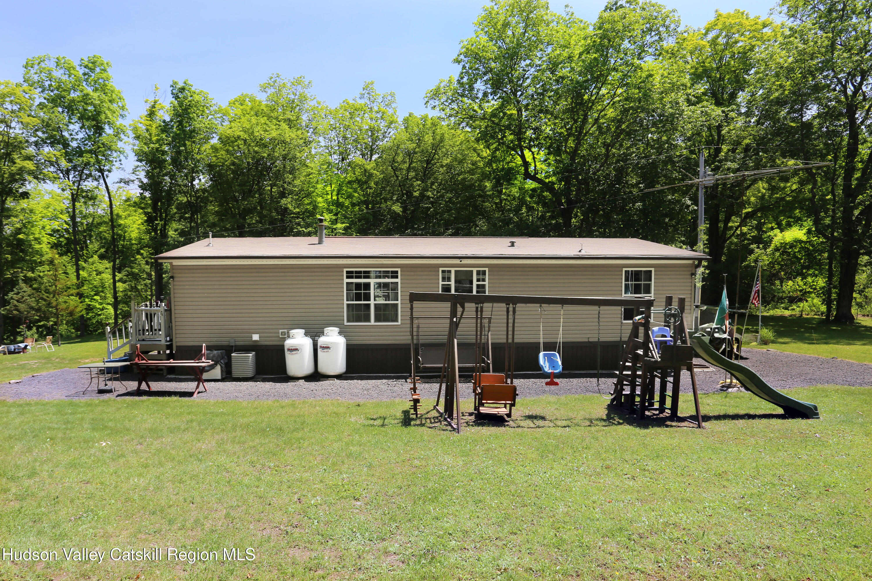 219 Edison Timmerman Road Cairo, NY 12413 - Photo 35 of 51 front view of a house with swimming pool and porch