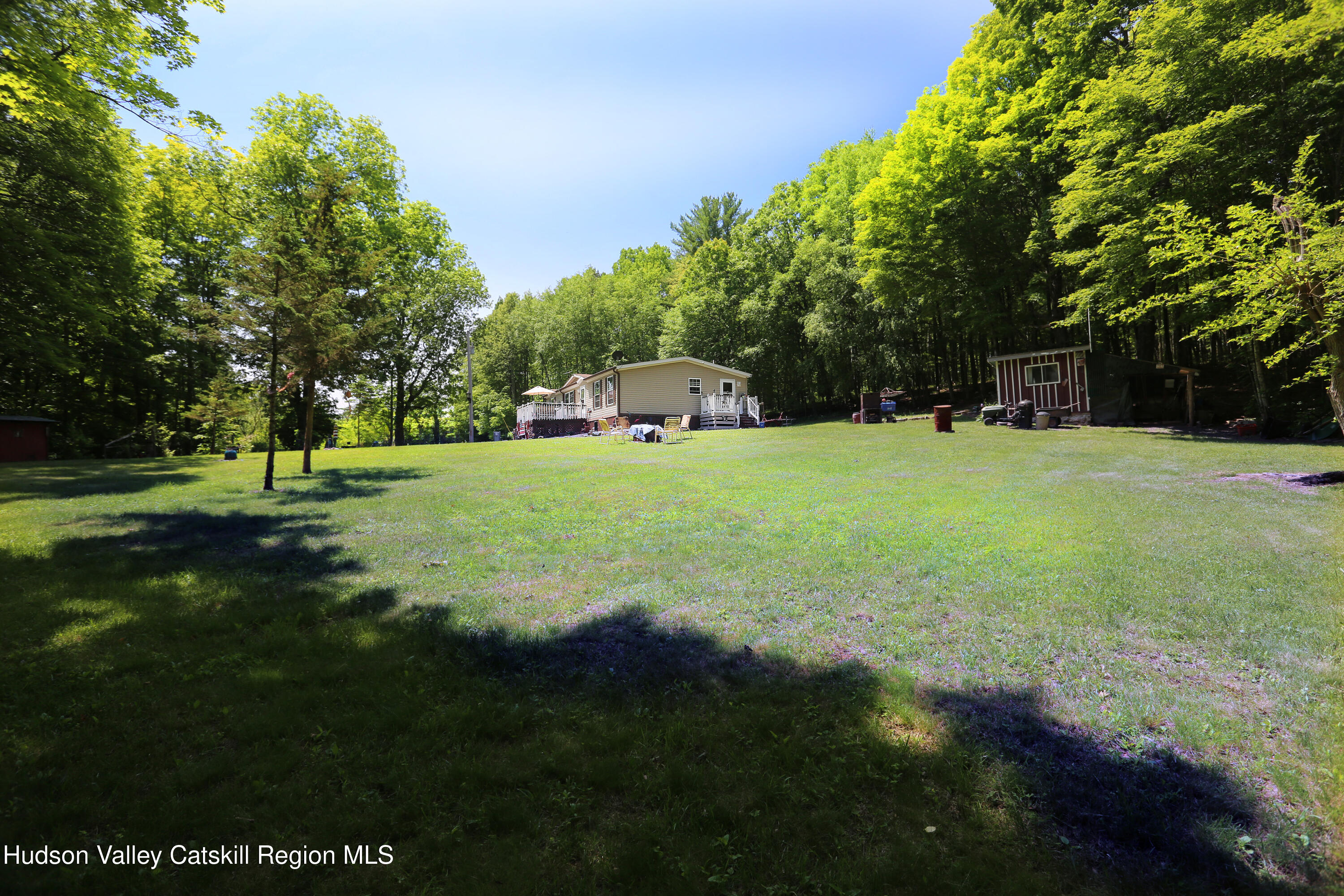 219 Edison Timmerman Road Cairo, NY 12413 - Photo 37 of 51 a backyard of a house with lots of green space and fountain