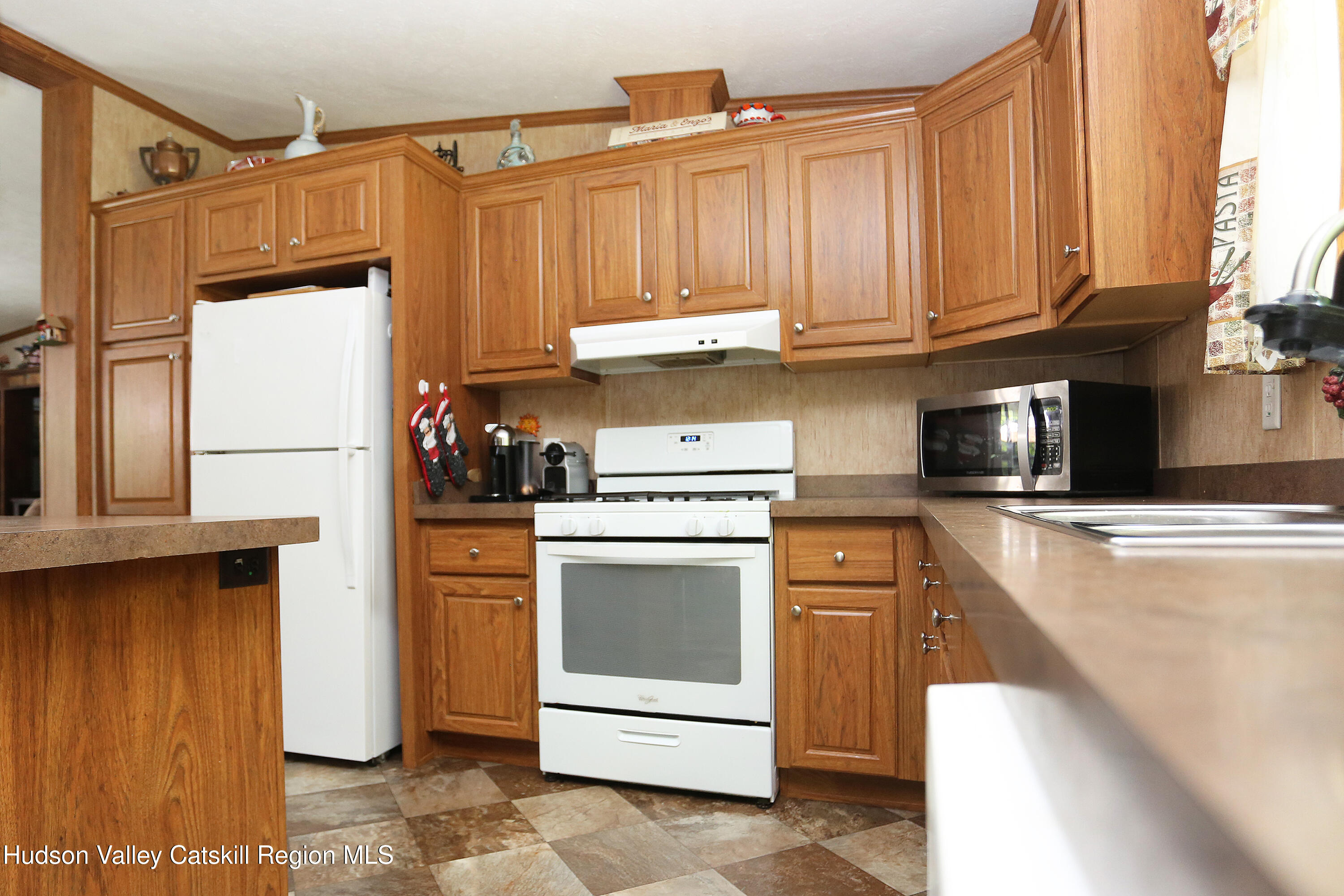219 Edison Timmerman Road Cairo, NY 12413 - Photo 6 of 51 a kitchen with a refrigerator sink and cabinets