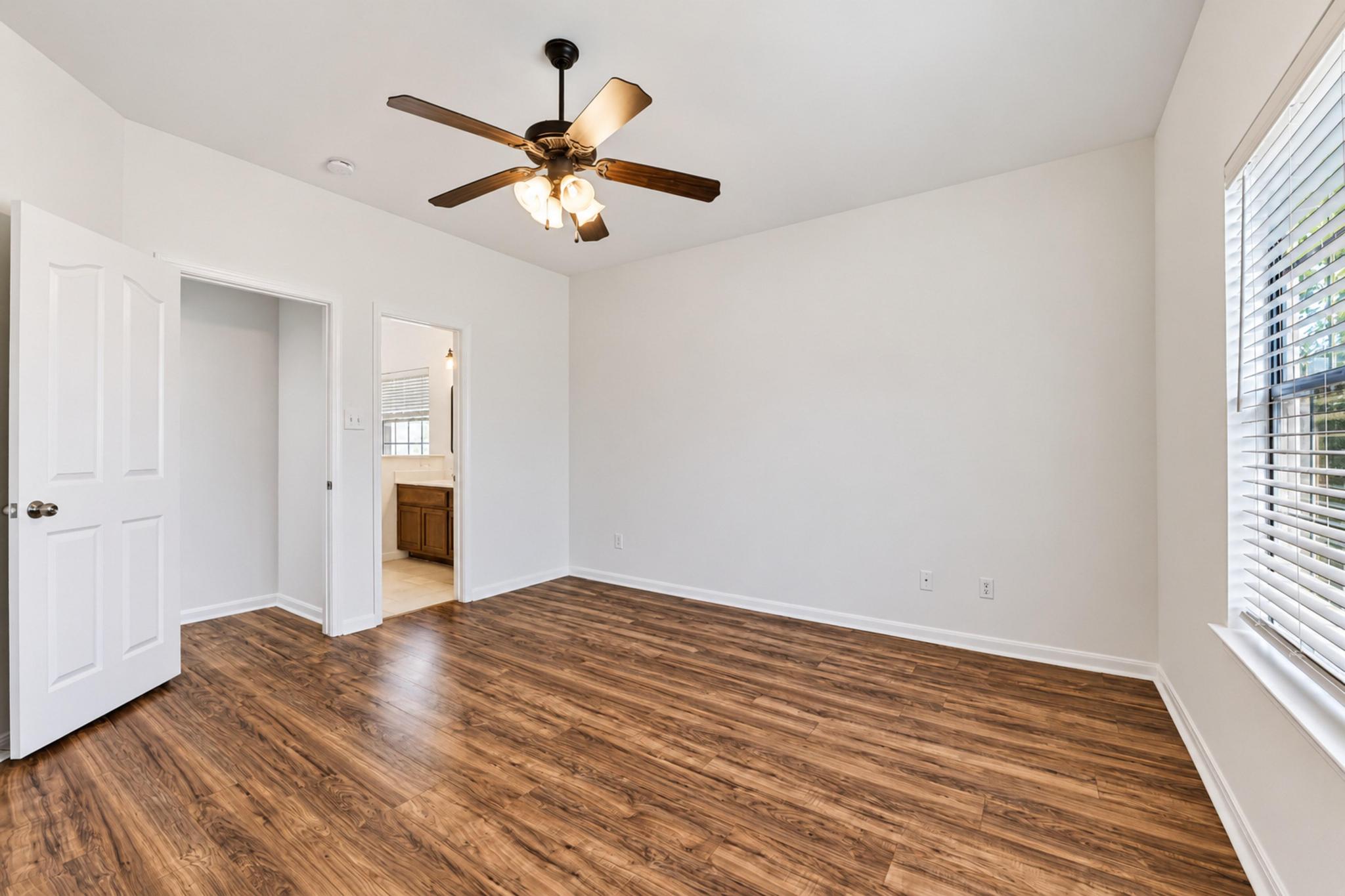 150 Engineers Pass Jarrell, TX 76537 - Photo 31 of 40 Gleaming wood flooring and crisp neutral walls define this versatile bedroom space.