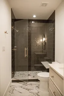 a spacious bathroom with a tub sink and mirror