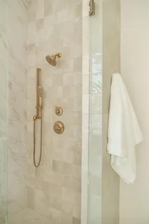 a bathroom with a shower toilet and sink