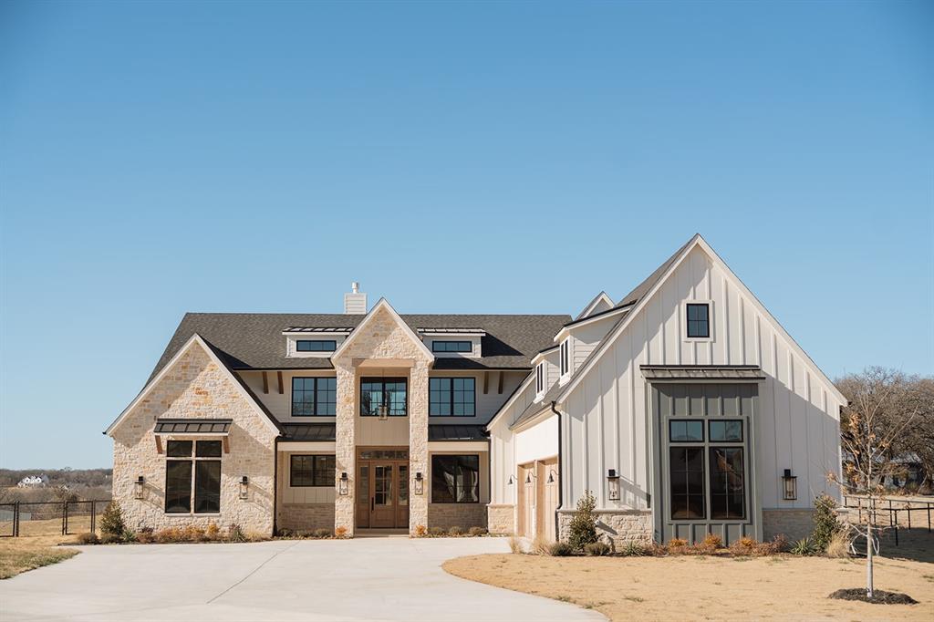 1070 Browning Road Argyle, TX 76226 - Photo 19 of 21 Modern inspired farmhouse with board and batten siding, driveway, a standing seam roof, and a chimney