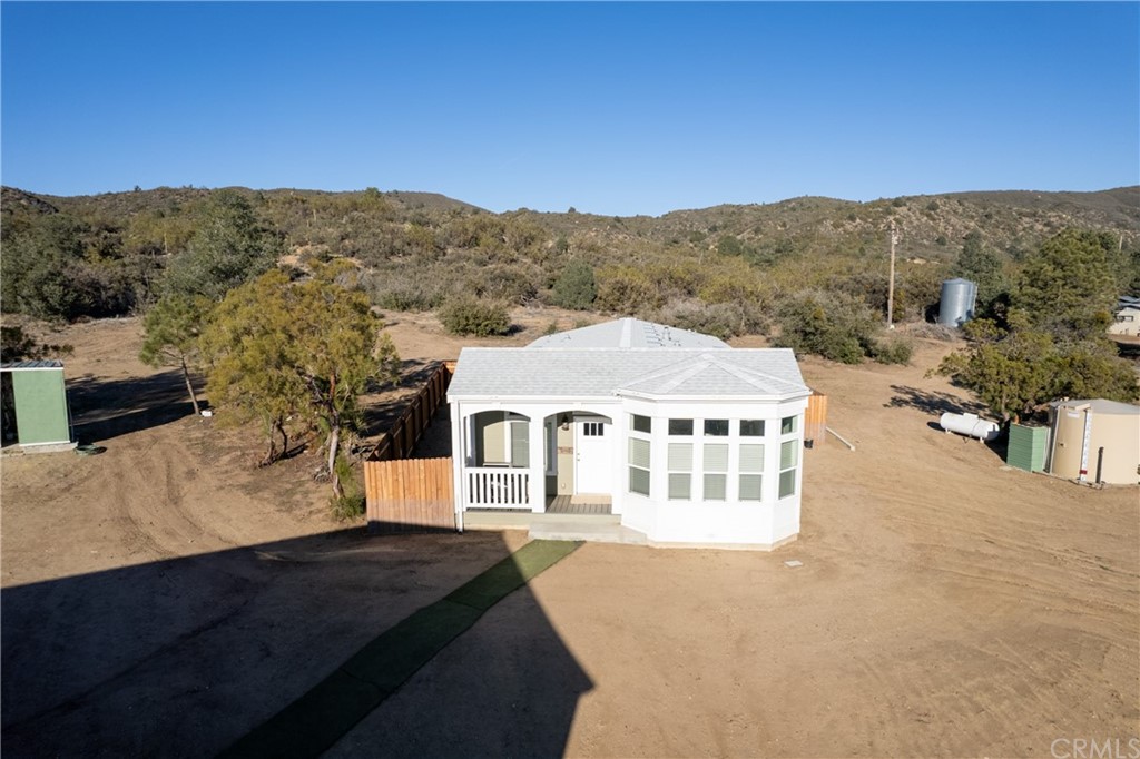 60600 Burnt Valley Road Anza, CA 92539 - Photo 29 of 46 a view of a big house with a mountain in the background