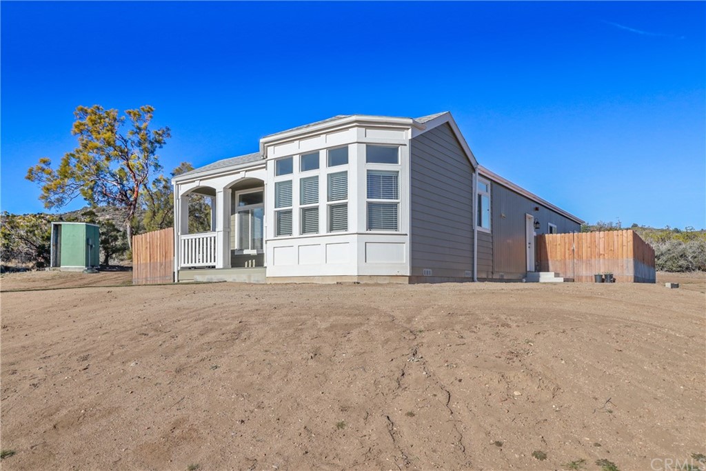60600 Burnt Valley Road Anza, CA 92539 - Photo 3 of 46 a front view of a house with a yard