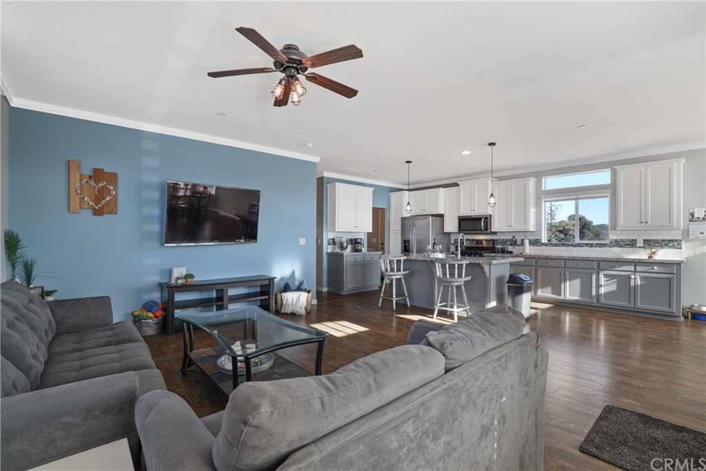 60600 Burnt Valley Road Anza, CA 92539 - Photo 7 of 46 a living room with furniture kitchen view and a flat screen tv