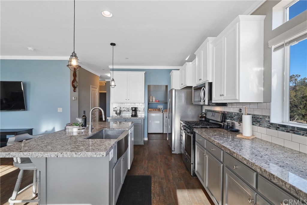 60600 Burnt Valley Road Anza, CA 92539 - Photo 10 of 46 a kitchen with stainless steel appliances granite countertop a sink stove and refrigerator